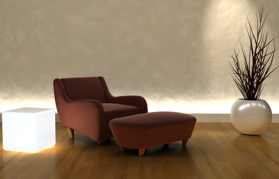Un sillón de lectura en una sala